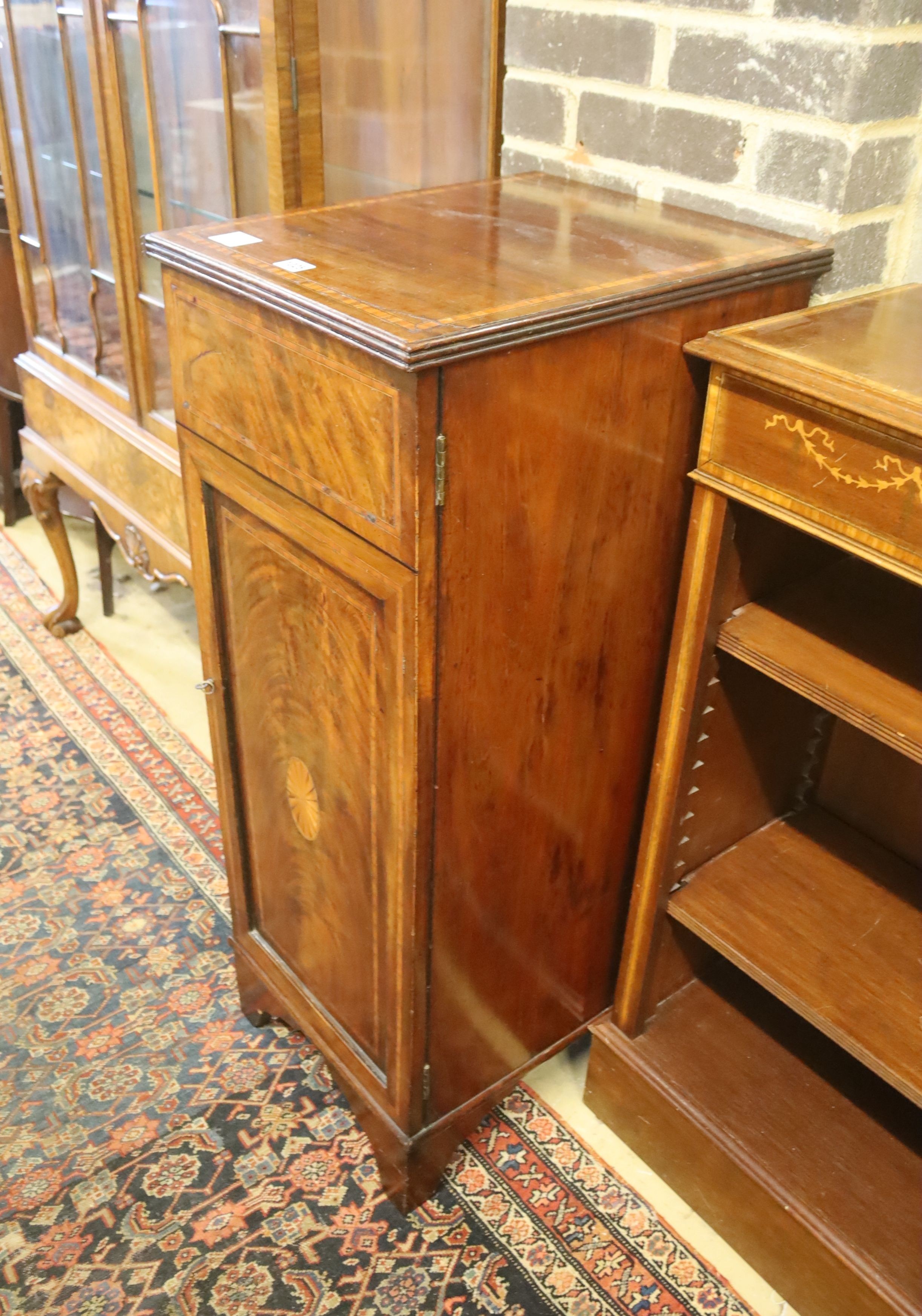 An Edwardian mahogany and satinwood banded pedestal cupboard, (formerly a sideboard section) width 40cm, depth 47cm, height 103cm